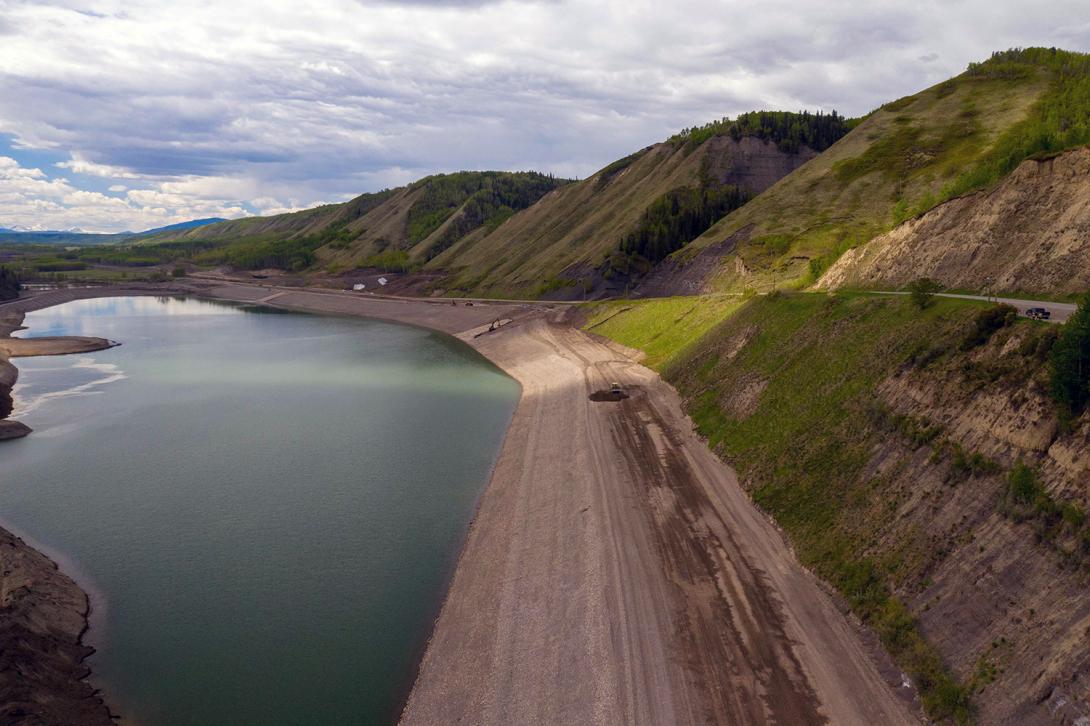 Work continues on the new Lynx Creek embankment on Highway 29, where crews are excavating and hauling rock aggregates to construct the highway. | May 2021