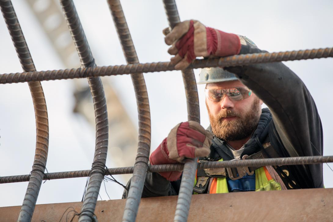 Workers installing rebar at the main service bay. | December 2018