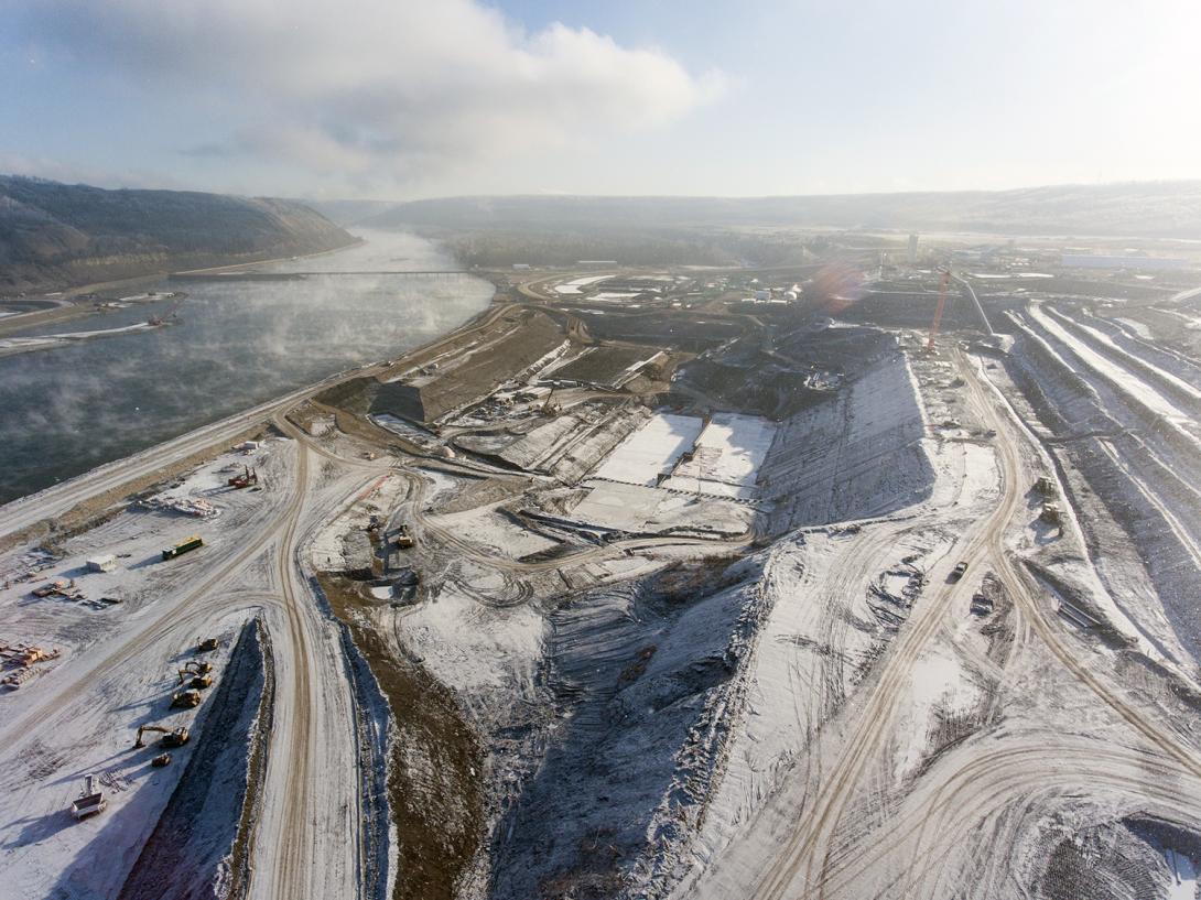 Aerial view of the south bank, with the powerhouse and spillway buttress and approach channel excavation | November 2017