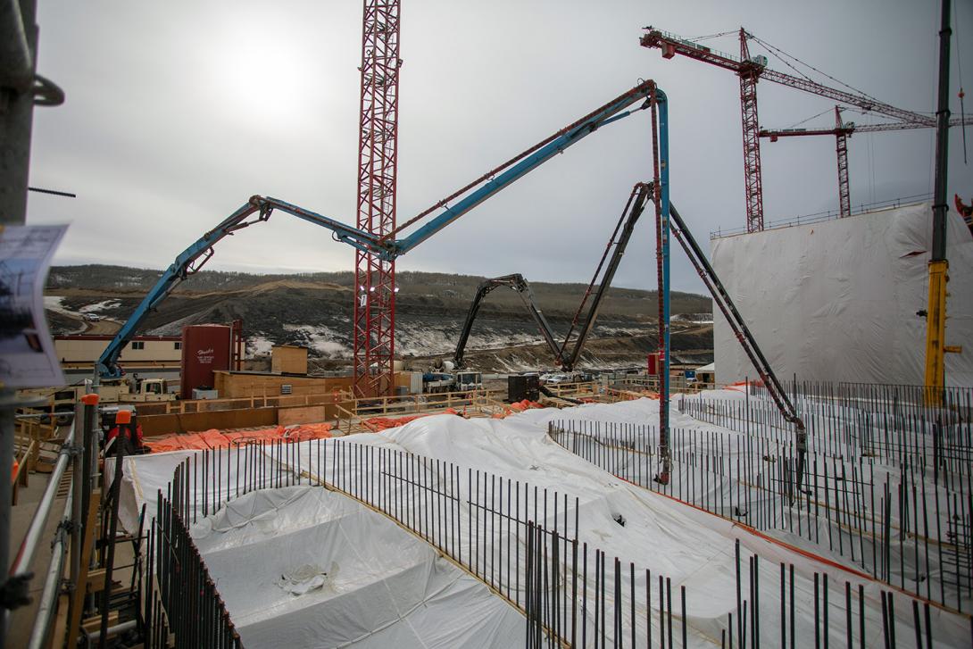 Ongoing concrete placement at the spillway headworks. | April 2021