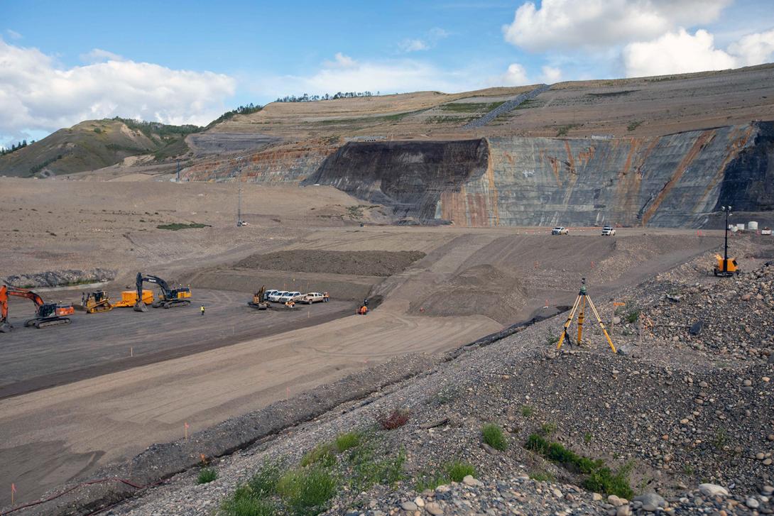 Crews place glacial till at the north end of the dam core trench. | September 2021