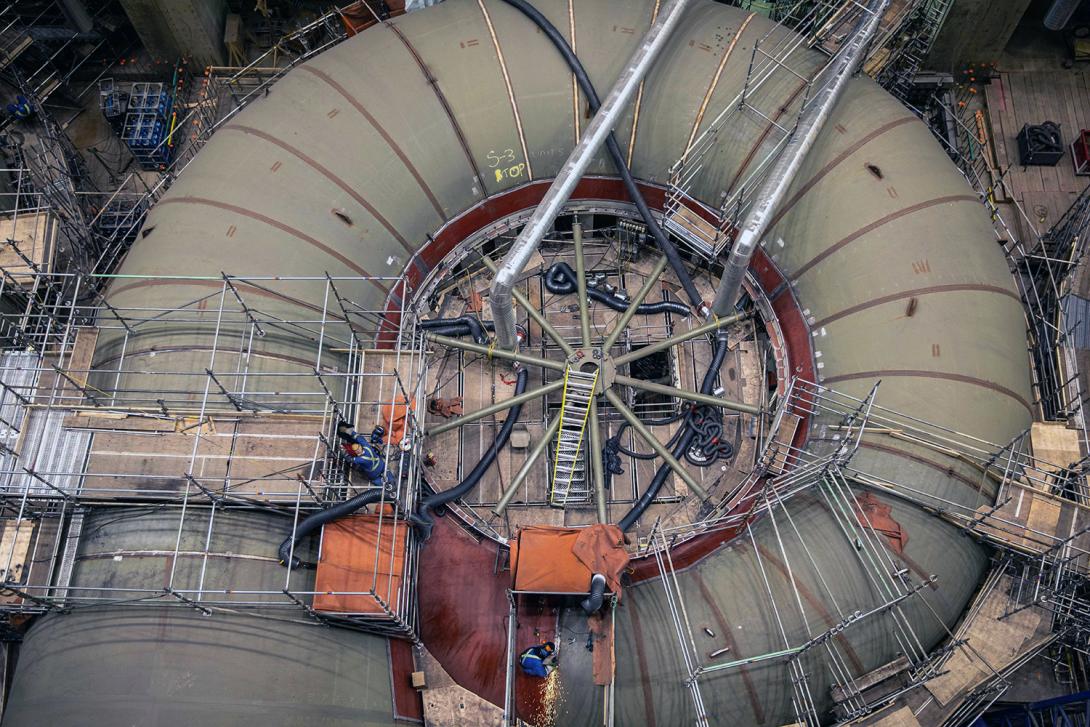 Welders work on the spiral case circumferential joints. | April 2022