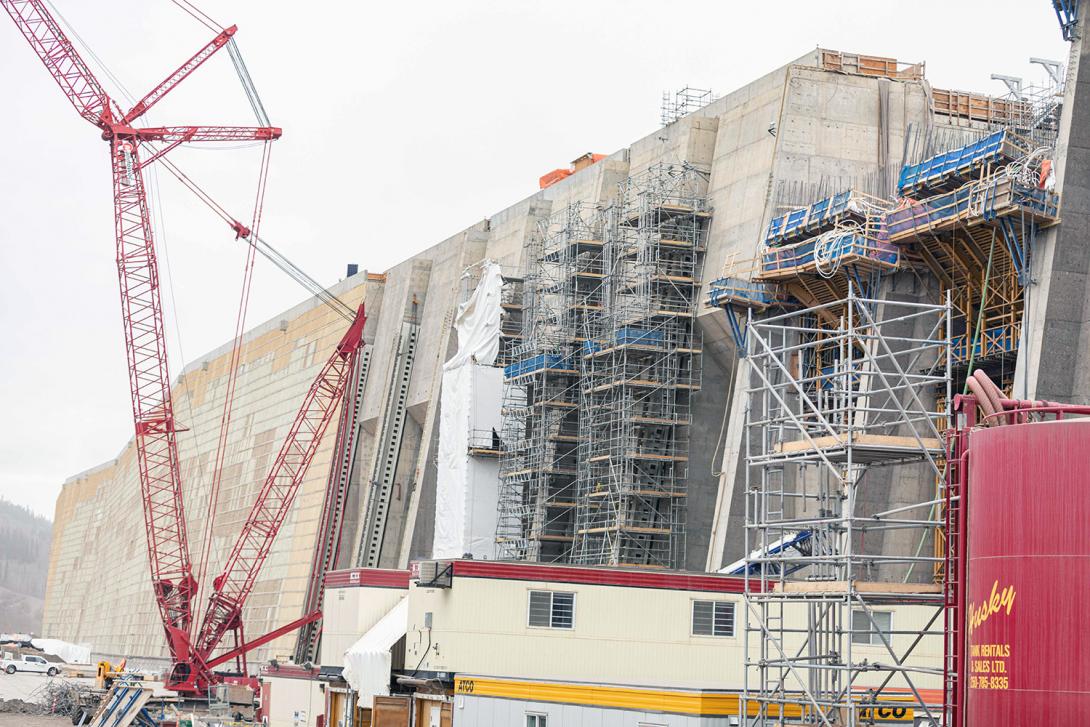 Scaffolding towers and hoarding, which protects from the cold, to install trash rack guides on the intakes. | November 2022