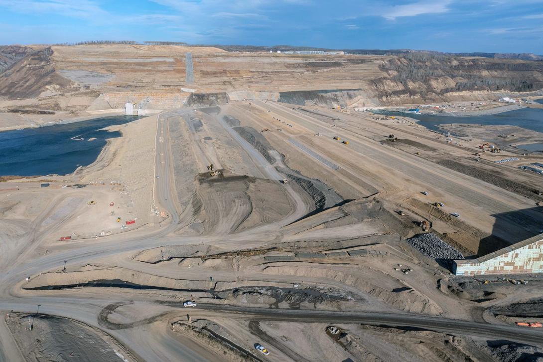 North-facing over the dam with the tail of the RCC Buttress in lower right. | October 2022