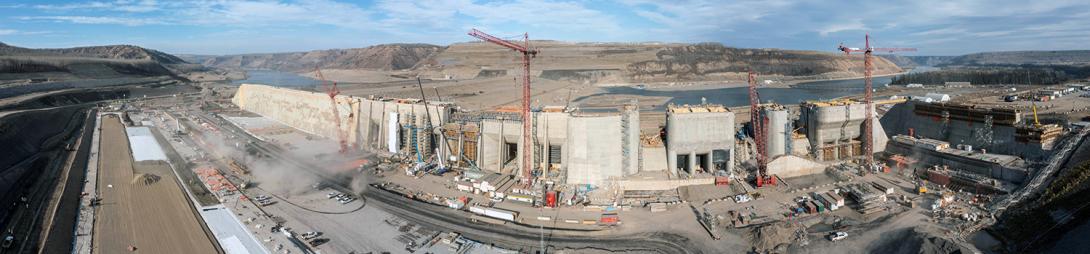 Upstream view of the approach channel. From right to left: the passive spillway, spillway upper headworks, intake gates, and buttress. | October 2022