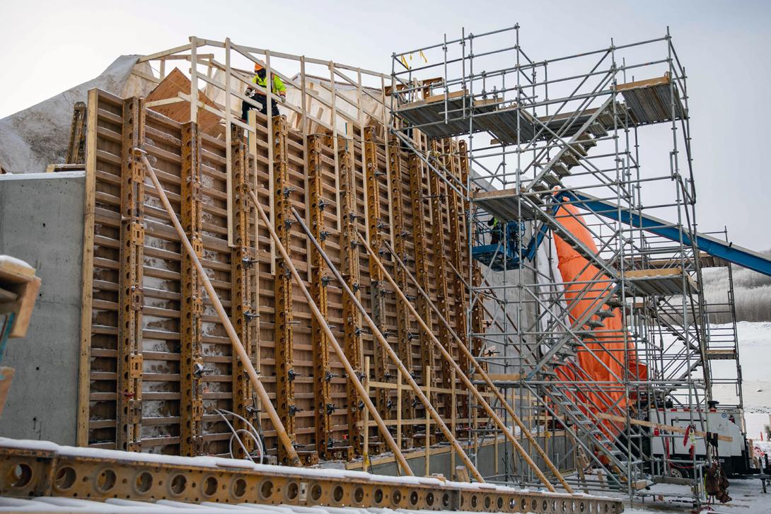 Installing the formwork to pour concrete on the west end of the approach channel wall. | March 2023