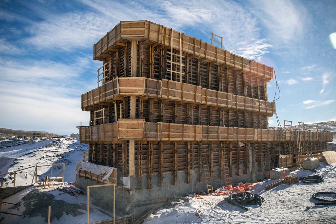 The end wall of the auxiliary spillway as it transitions into the slurry wall. This is a trench filled with a concrete mix and rebar (slurry) down to bedrock to prevent water seepage. | March 2023