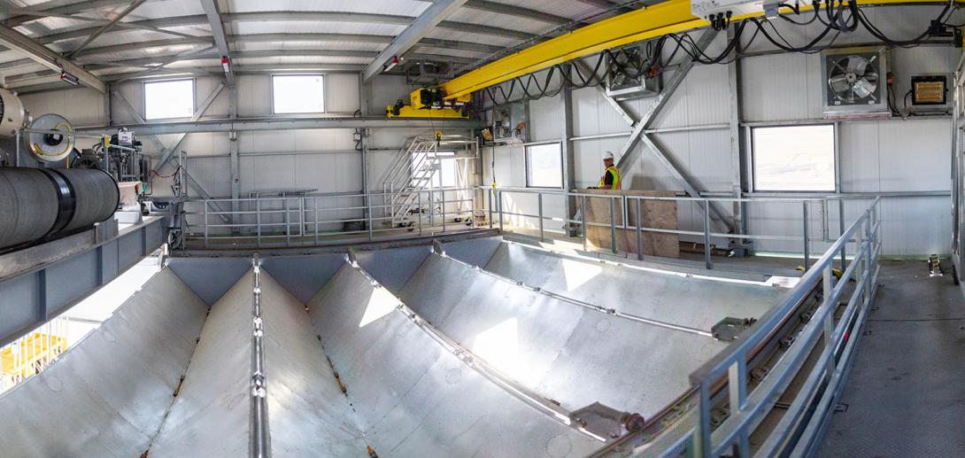 The floor inside the intake gantry crane folds back so the crane can lift the intake gate. | July 2023