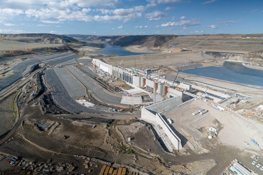 Water will flow down the approach channel on the left and through the intake gates to the right.