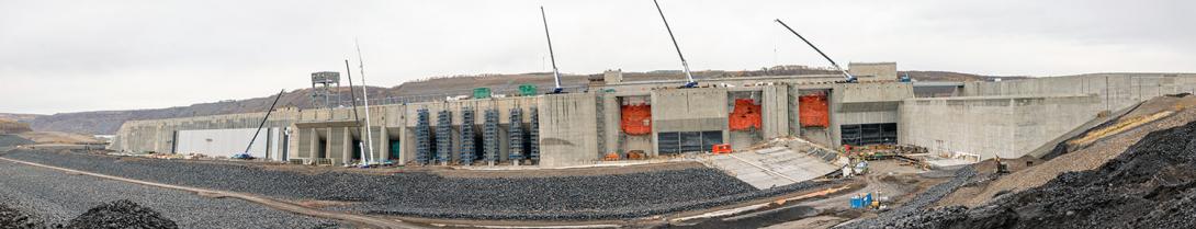 On the upstream side of the generating station, water flows from the approach channel into the six intake units.